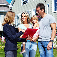 Family talking to realtor about VA Home loan